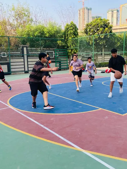 Players run a drill, focusing on passing and movement.