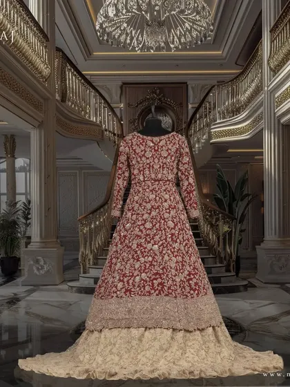 A studio shot of the reddish maroon Indo-Western outfit, a masterpiece of cultural fusion and handcrafted elegance.