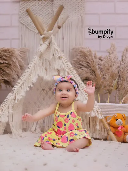 A happy wave from our little adventurer in the teepee. Studio sessions are great for capturing these cute, interactive moments.