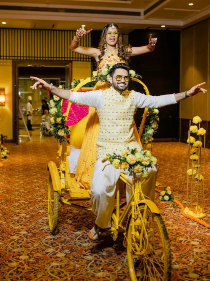 A quirky and fun Haldi entry on a decorated cycle rickshaw. We love creating unique entry concepts that reflect the couple's personality and the event's theme.