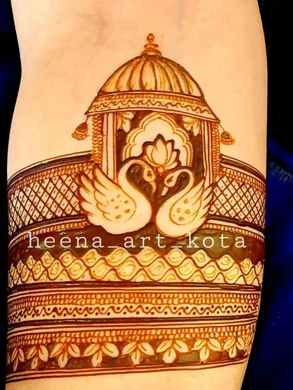 A beautiful arm band design featuring a pair of swans under a royal gazebo, a classic and romantic motif.