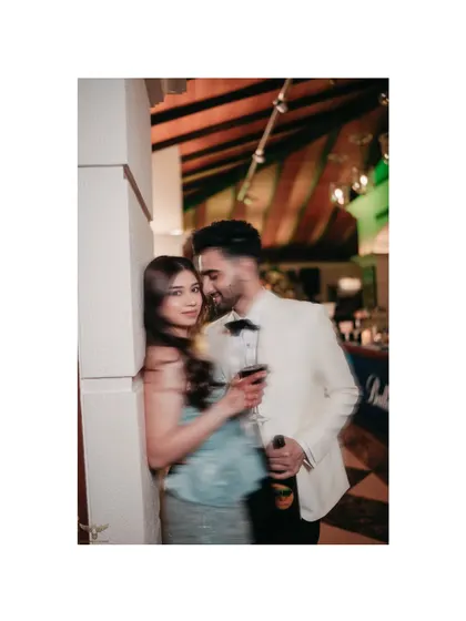 Another artistic shot using a slow shutter speed to create a sense of intimacy and movement. The focus remains on the couple's close connection, even with the creative blur effect.