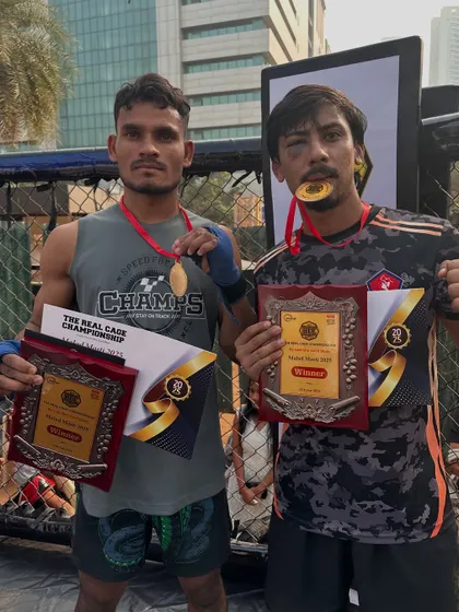 Two of our warriors with their well-earned plaques after the Real Cage Championship. The result of dedication and a "never give up" attitude.