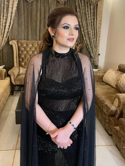 A powerful black smokey eye for an evening wedding event. I love how this look brings all the attention to her beautiful eyes.