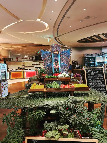 A fresh vegetable display as part of the Sri Lankan festival decor. Using fresh produce as a decorative element adds color, texture, and a farm-to-table feel that complements the food theme.