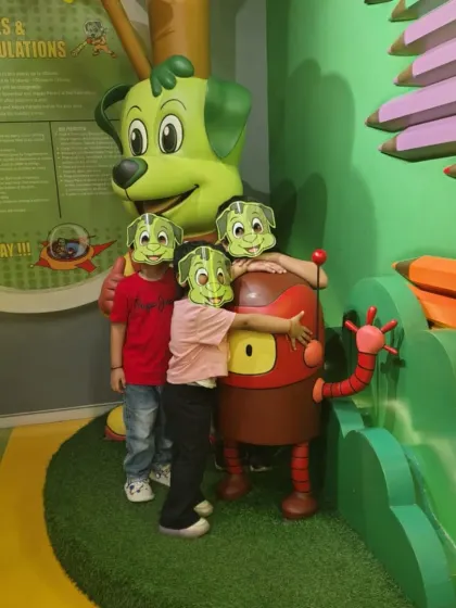 Masked but still smiling. A group of kids have fun posing with our mascots, showing that even with safety measures, the fun never stops.