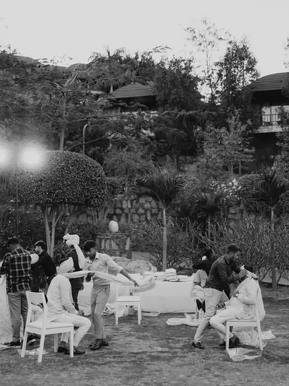 A wide, atmospheric black and white shot of the wedding setup after hours. This quiet, documentary-style photo adds a different mood to the wedding story.