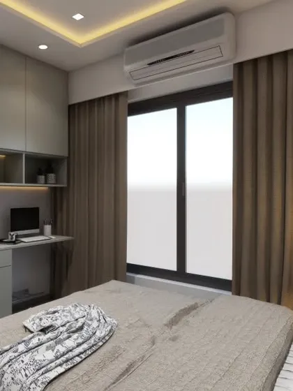 This bedroom design incorporates a compact study nook with overhead cabinets, perfect for working from home. The neutral color palette and simple lines create a calm and focused environment.