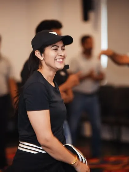 A candid moment of laughter and joy during a corporate dance workshop. These are the moments that build lasting team camaraderie.