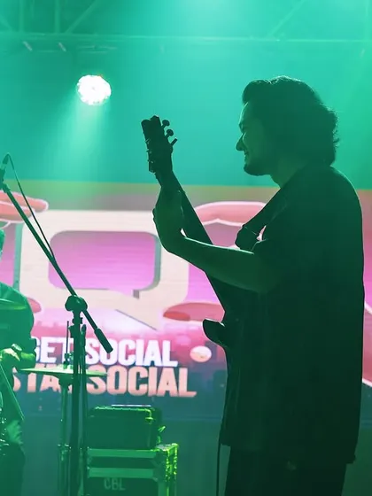 A silhouette of our guitarist against the event's branding. We seamlessly integrate into your event's theme, making our performance a natural extension of your brand.