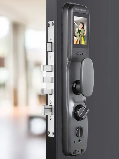 A closer look at a smart lock with a built-in screen, showing a visitor's face. This feature allows you to visually verify who is at your door directly on the lock itself.
