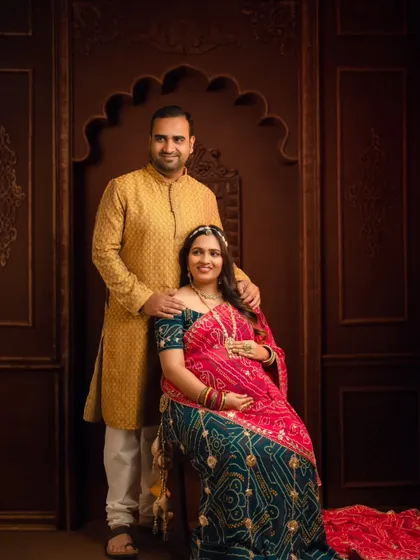 A classic, regal portrait of a couple in traditional Rajasthani attire, exuding grace and cultural pride.