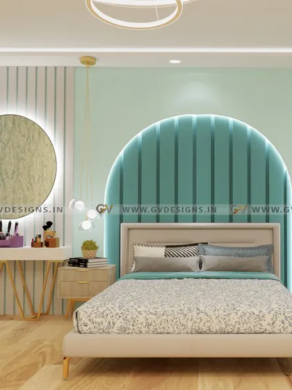 We used a soothing pastel blue-green hue to create a tranquil atmosphere in this bedroom. The design features an arched, fluted headboard, a separate dressing console with a backlit mirror, and elegant hanging pendant lights.