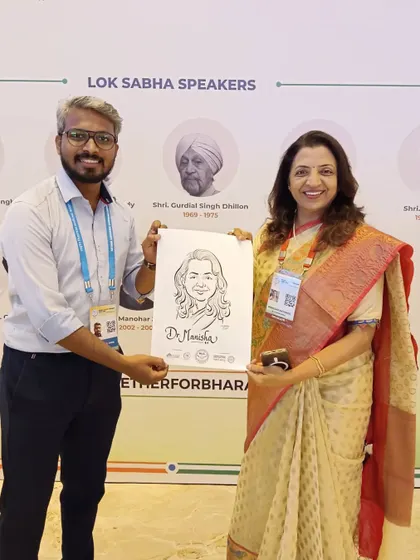 Presenting a caricature to Dr. Manisha Kayande at the NLC. It was a wonderful experience meeting and drawing legislators from across the country.
