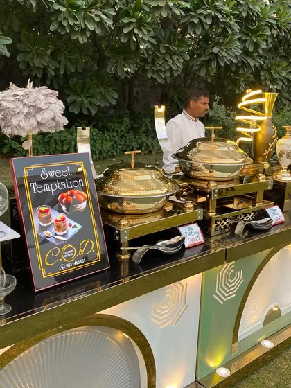The dessert section of our buffet, labeled "Sweet Temptation." We use elegant glassware and premium serving dishes to make our desserts look as good as they taste.