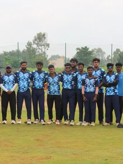 A youth team in their blue jerseys poses for a photo before their Dasara Cup match.