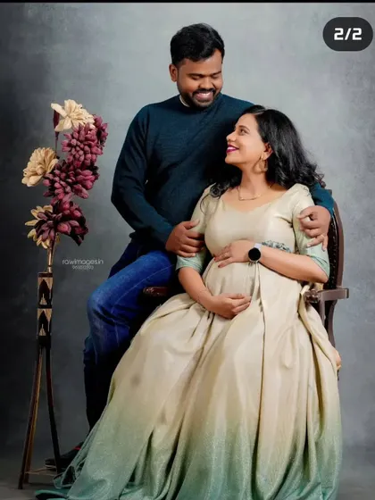 A happy couple's portrait from their indoor maternity shoot. I styled both of them to create a warm and loving image that they can cherish forever.