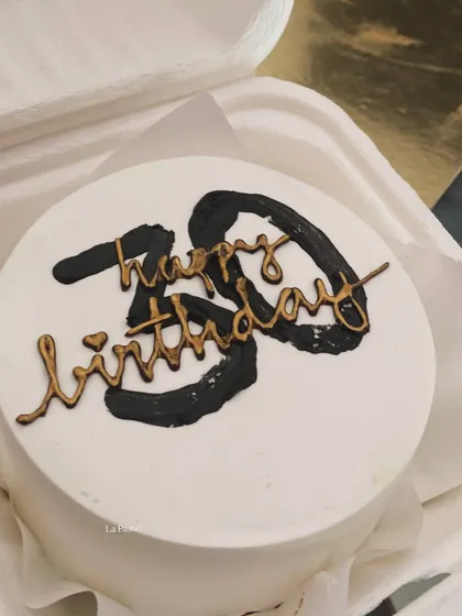 A bold and stylish bento cake for a 30th birthday, with modern black brushstrokes and gold calligraphy.