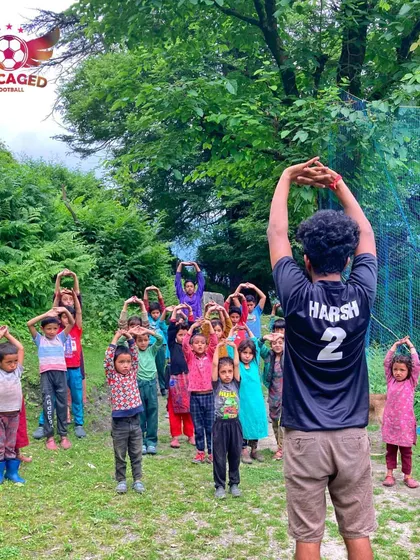 We start every session with energy and focus. Here, we are leading a morning warm-up and stretching session with the children of Grahan village, getting them ready for a day of learning football fundamentals in the beautiful Parvati Valley.
