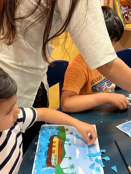 A close-up of a collage activity during spring camp. These projects help develop fine motor skills and creativity.