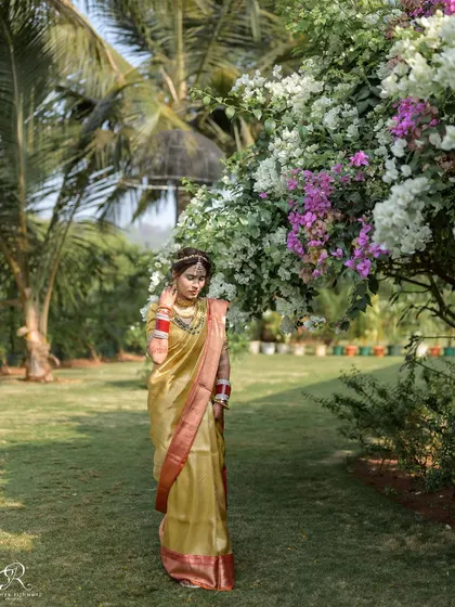 The bride standing amongst the bougainvillea, a perfect pop of color for her portrait.