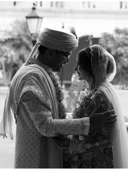A classic black and white portrait of the couple looking at each other with love. The timeless feel of this image makes it a perfect keepsake from their wedding day.