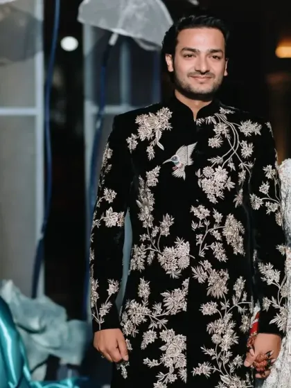 The couple makes their grand reception entrance in Bahrain, looking every bit the part of modern royalty. The unique entertainment, like this costumed cellist, adds a touch of whimsical elegance.