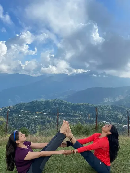A fun and challenging partner pose, building strength and trust together on our Nepal retreat.