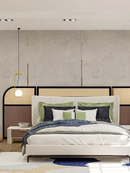 This modern bedroom combines a rattan headboard with a dusty pink accent and a concrete-finish wall panel for a unique textural mix.