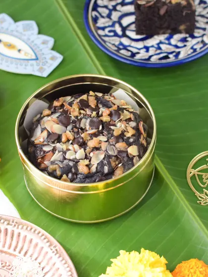 My Ragi Chocolate Walnut Cake packed in its golden tin, ready for gifting.