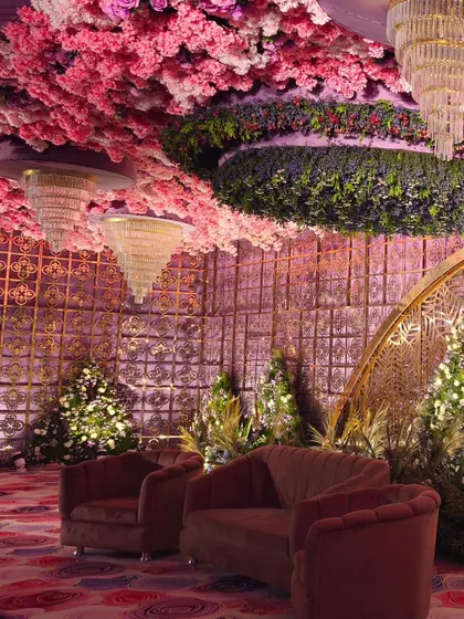 This view shows the interplay of textures and colors, from the floral ceiling to the patterned carpet and velvet sofas. It's a testament to how I layer details to create a rich visual experience.