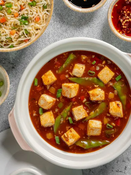 A close-up of the Mapo Tofu, showing the soft tofu cubes in a spicy sauce.