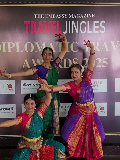 Three of my students striking a classic Bharatanatyam pose. Their expressions and postures reflect the storytelling and grace inherent in the dance.