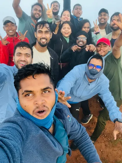 The energy is high after completing the Skandagiri trek. A group selfie capturing the sense of achievement.