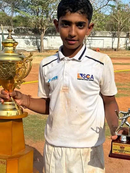 Darshan Rathod, the Man of the Match in the MSV Cup final, with the championship trophy.