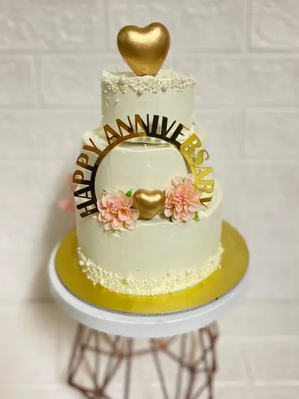 The mini three-tier chocolate truffle cake we made for an anniversary. It's small in size but big on elegance.