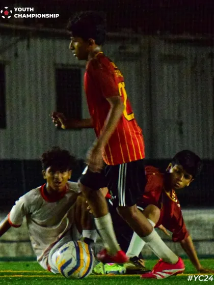 Intense action from the Under 15 Youth Championship finale, with players battling for possession.