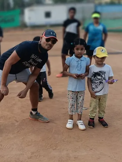 A fun pose with two of our youngest students. My goal is to make their first experience with tennis positive and memorable, setting the foundation for a lifelong passion.