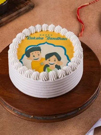 A photo cake for Raksha Bandhan, featuring a sweet illustration of a brother and sister. It’s a wonderful way to celebrate that special sibling bond.