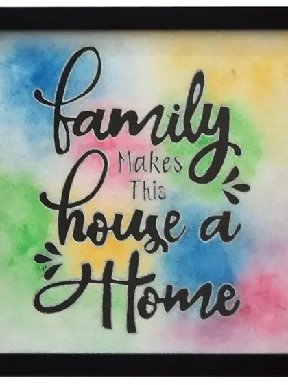 'Family Makes This House a Home'. A small watercolor piece with a colorful, blended background. This was a custom order, and it's a perfect example of a heartfelt, personalized gift.