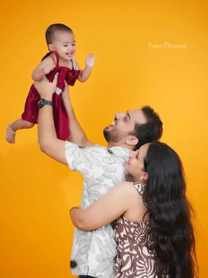 Flying high on dad's love. We aim to capture the dynamic and joyful interactions within your family.