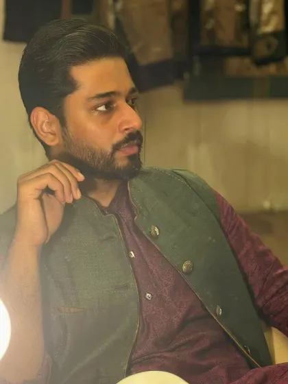 This candid-style shot in a kurta and Nehru jacket shows a more pensive and thoughtful expression. It highlights my versatility in portraying different moods for a campaign's narrative.