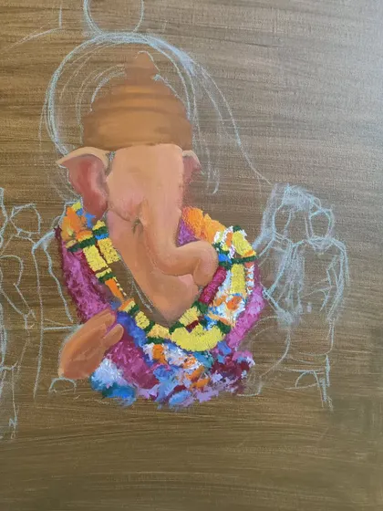 The painting process continues, with the central figure of Ganesha beginning to take shape. The vibrant colors of the garland are applied first to serve as a focal point.