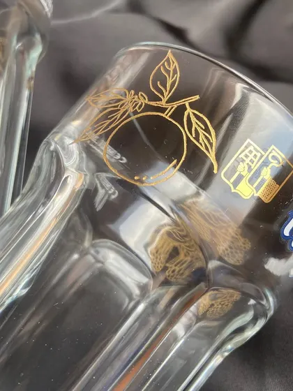 For this project with Hoegaarden India, I engraved their classic beer glasses with names and custom illustrations of oranges and raspberries, as a nod to the beer's flavors. It was so much fun to bring this idea to life.