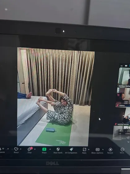 Even from a screen, I can see the effort and progress. A student practices a seated forward bend variation in our online class.