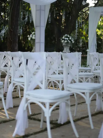 Another view of the elegant white guest seating, ready for a beautiful outdoor ceremony.