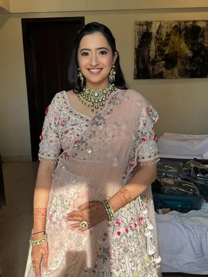 Enhancing natural beauty with soft, radiant makeup. This look is perfect for a wedding guest or family member, featuring a glowing complexion and defined eyes.