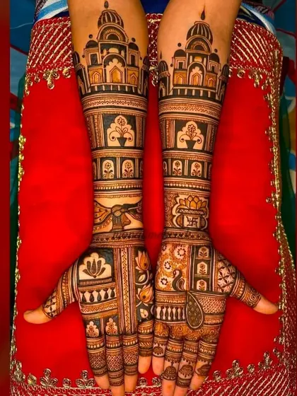 A unique and modern take on bridal mehndi, with bold geometric blocks, architectural elements, and lotus flowers. This design is for the bride who wants something different.