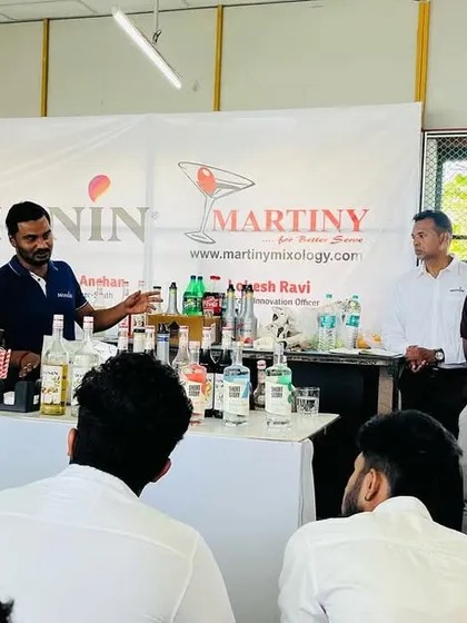 An instructor from Monin India explains the nuances of different syrups to an engaged class of our students.