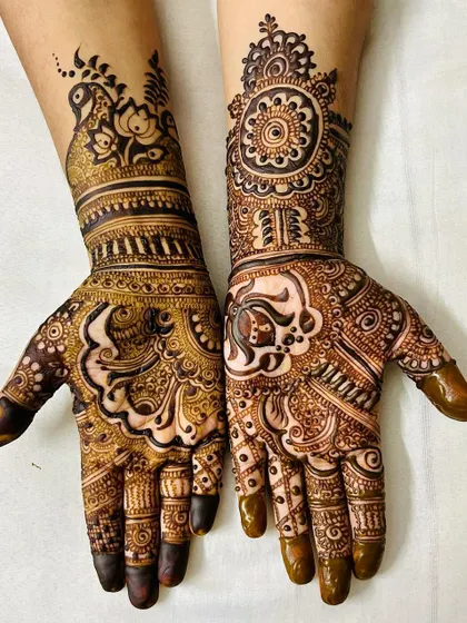 A rich and detailed design perfect for Teej or Karvachauth. The artwork features a mix of bold Arabic-style shading and fine traditional lines, with peacock and floral elements.